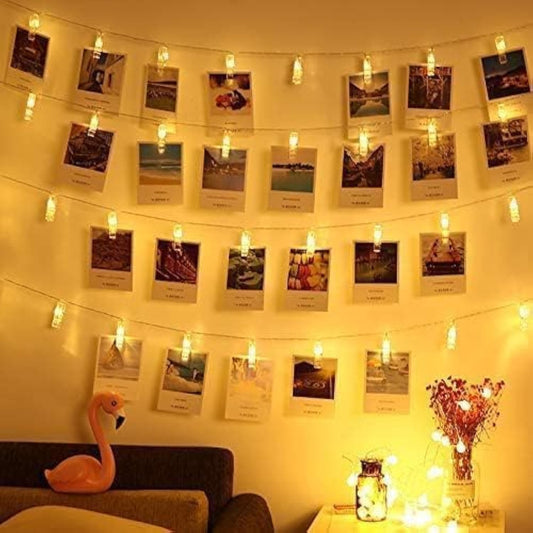integrated transparent photo clips on each bulb holder for clipping pictures or small items