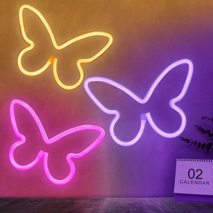 three-piece butterfly neon sign set in pink, purple, and warm white